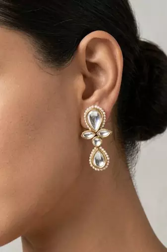 white alloy earrings with kundan pearl drop floral work