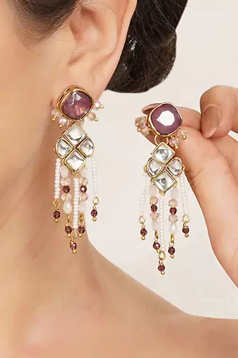 purple alloy earrings with kundan pearl work design