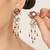 purple alloy earrings with kundan pearl work design