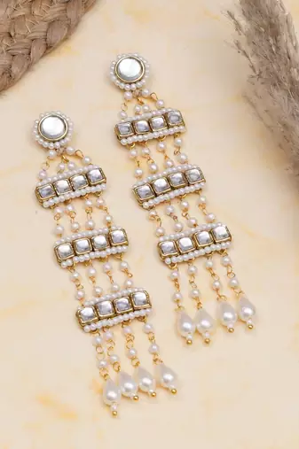 white alloy earrings with kundan pearl drop work