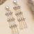 white alloy earrings with kundan pearl drop work