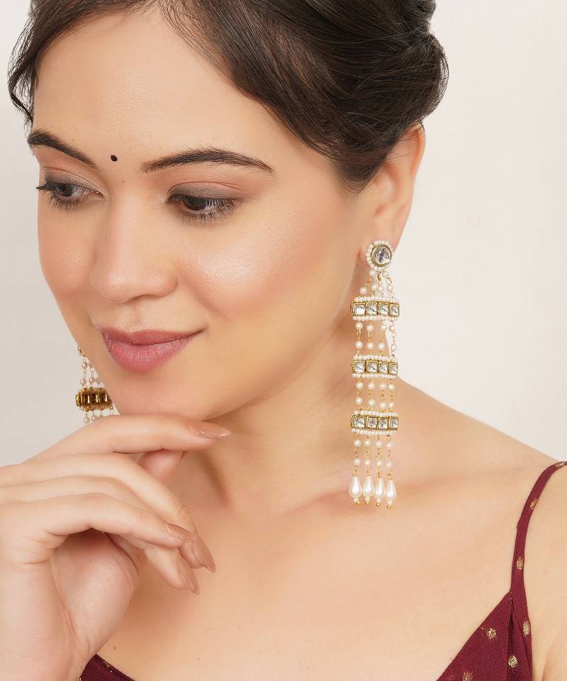 white alloy earrings with kundan pearl drop work