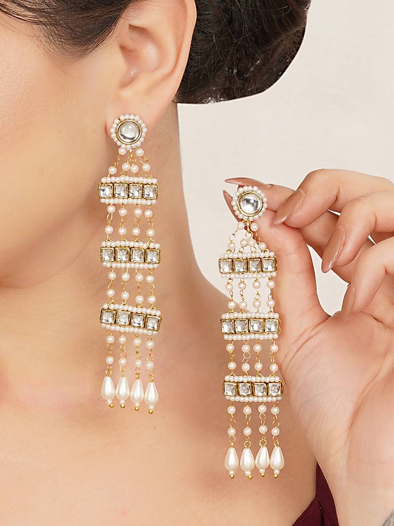 white alloy earrings with kundan pearl drop work