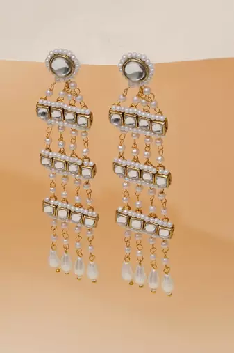 white alloy earrings with kundan pearl drop work