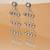 white alloy earrings with kundan pearl drop work