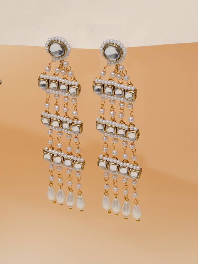 white alloy earrings with kundan pearl drop work