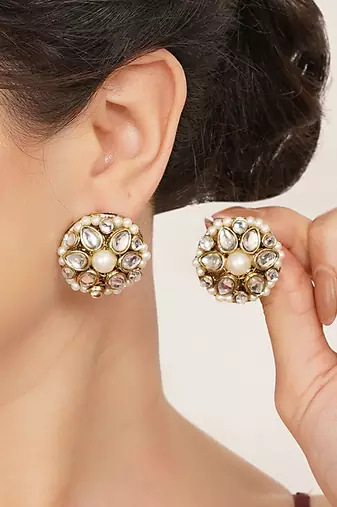 white alloy earrings with mini kundan flower work