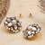 white alloy earrings with mini kundan flower work