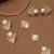 golden brass necklace set with pearl geometric design