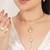 golden brass necklace set with pearl geometric design