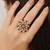 blush alloy ring with kundan floral design