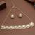 golden brass necklace set with pearl halo work