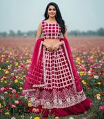 rani pink net lehenga choli with thread work design