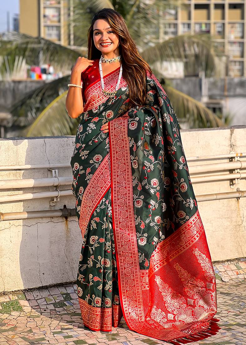 Dark green woven self design pure silk banarasi saree with blouse