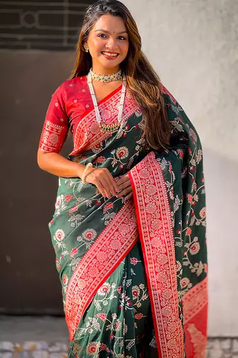 Dark green woven self design pure silk banarasi saree with blouse