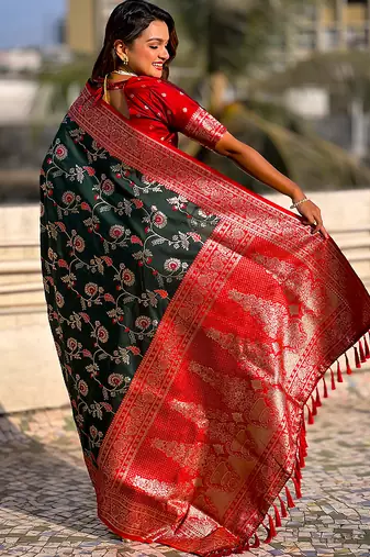 Dark green woven self design pure silk banarasi saree with blouse