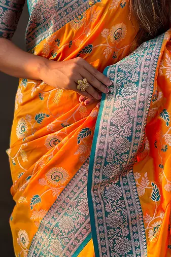 Orange woven self design pure silk banarasi saree with blouse