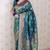 Teal green woven self design pure silk banarasi saree with blouse