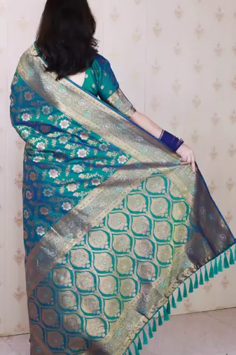 Teal green woven self design pure silk banarasi saree with blouse
