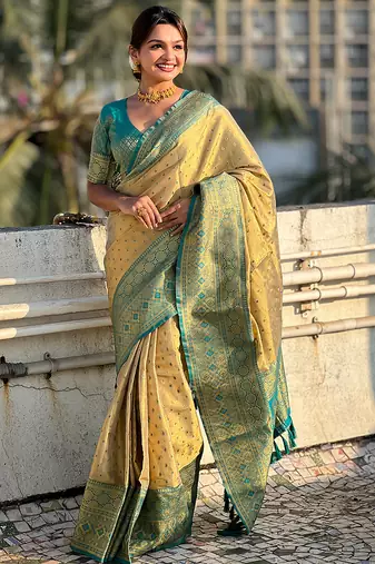 Beige woven self design embellished tissue kanjivaram saree with blouse