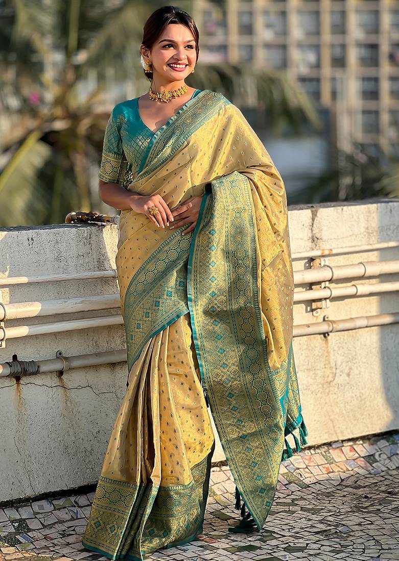 Beige woven self design embellished tissue kanjivaram saree with blouse