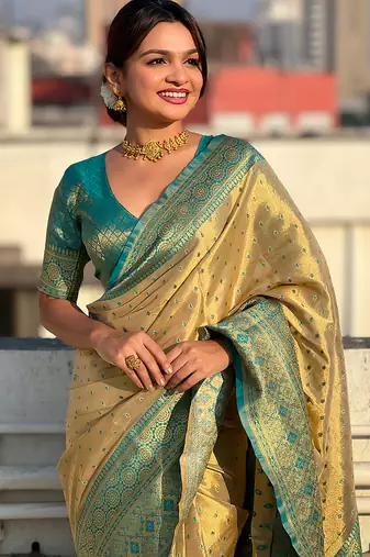 Beige woven self design embellished tissue kanjivaram saree with blouse