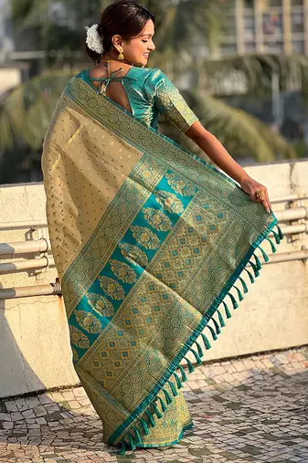 Beige woven self design embellished tissue kanjivaram saree with blouse
