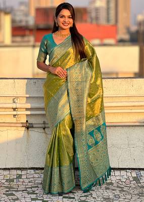 Green woven self design embellished tissue kanjivaram saree with blouse 1