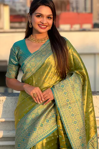 Green woven self design embellished tissue kanjivaram saree with blouse