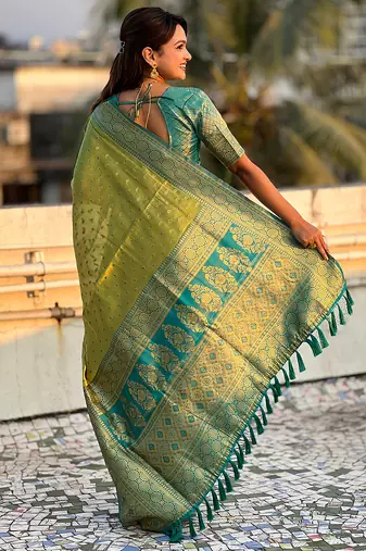 Green woven self design embellished tissue kanjivaram saree with blouse