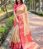 Beige woven self design embellished tissue kanjivaram saree with blouse