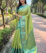 Green woven self design embellished tissue kanjivaram saree with blouse