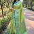 Green woven self design embellished tissue kanjivaram saree with blouse