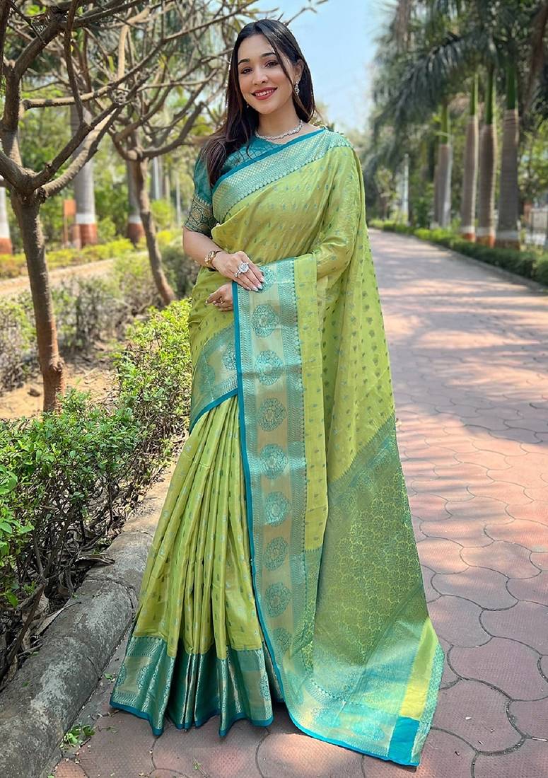 Green woven self design embellished tissue kanjivaram saree with blouse