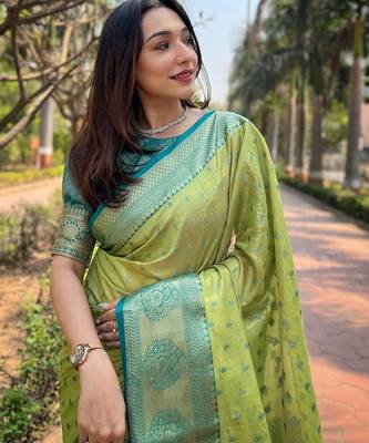 Green woven self design embellished tissue kanjivaram saree with blouse 2