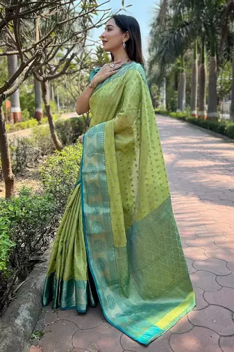 Green woven self design embellished tissue kanjivaram saree with blouse