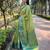 Green woven self design embellished tissue kanjivaram saree with blouse