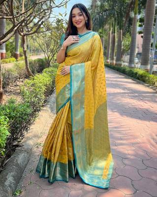 Yellow woven self design embellished tissue kanjivaram saree with blouse 1