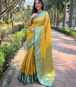 Yellow woven self design embellished tissue kanjivaram saree with blouse