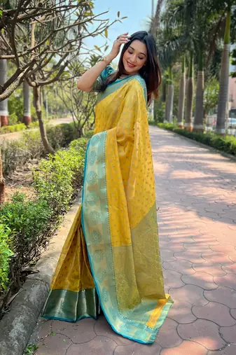 Yellow woven self design embellished tissue kanjivaram saree with blouse