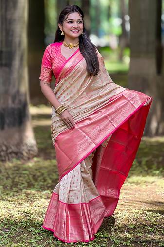Beige woven self design embellished tissue kanjivaram saree with blouse