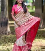 Beige woven self design embellished tissue kanjivaram saree with blouse