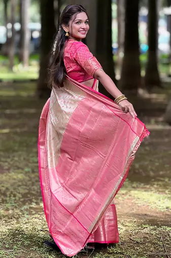 Beige woven self design embellished tissue kanjivaram saree with blouse