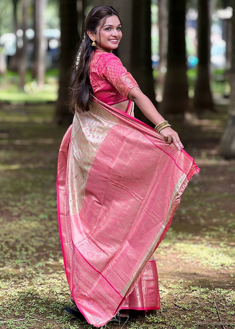 Beige woven self design embellished tissue kanjivaram saree with blouse