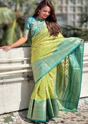 Green woven self design embellished tissue kanjivaram saree with blouse 1