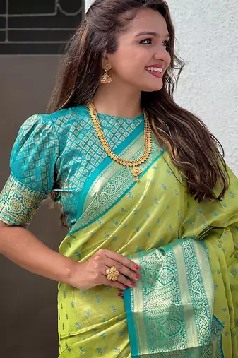 Green woven self design embellished tissue kanjivaram saree with blouse