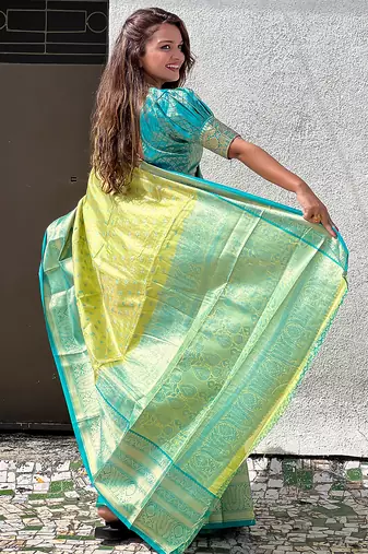 Green woven self design embellished tissue kanjivaram saree with blouse