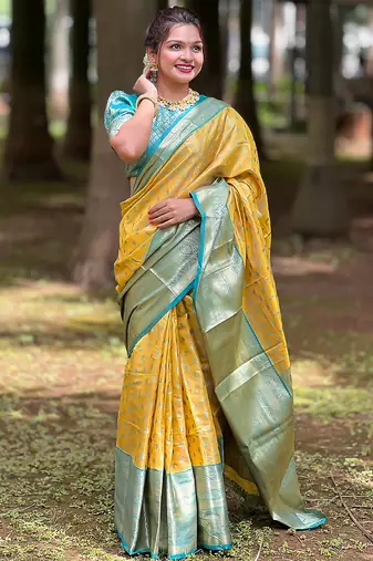 Yellow woven self design embellished tissue kanjivaram saree with blouse