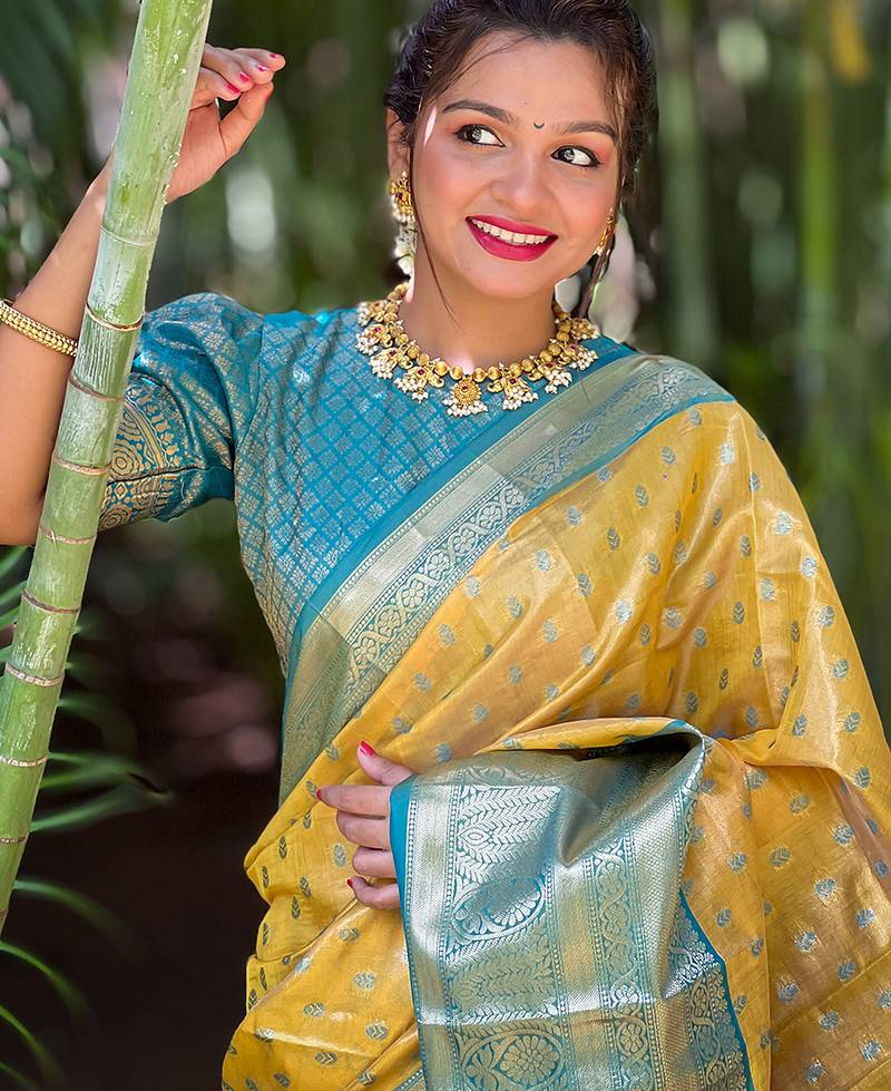 Yellow woven self design embellished tissue kanjivaram saree with blouse