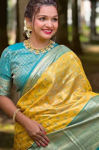 Yellow woven self design embellished tissue kanjivaram saree with blouse